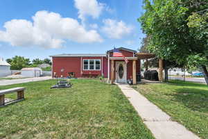 View of front of home featuring a storage unit