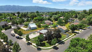 Aerial perspective of suburban area with a mountainous background
