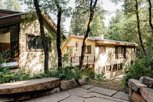 View of home's exterior featuring stucco siding and a chimney