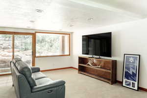 media / game room with sliding door to back yard