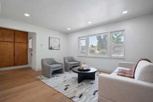 Living room featuring light wood-style floors and recessed lighting