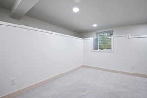 Below grade area with recessed lighting and carpet floors