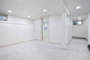 Basement with carpet and recessed lighting