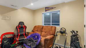 Living area featuring carpet floors and recessed lighting