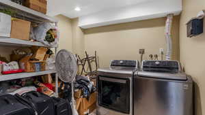 Laundry room featuring washing machine and clothes dryer