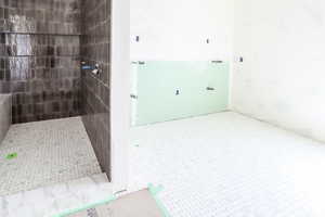 Full bathroom with a tile shower