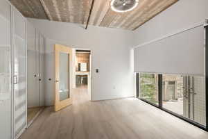Spare room featuring wood finished floors