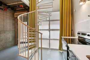 Stairs featuring concrete floors