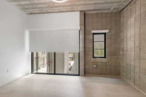 Unfurnished room featuring wood finished floors