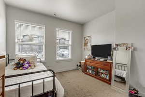 Bedroom with carpet and baseboards