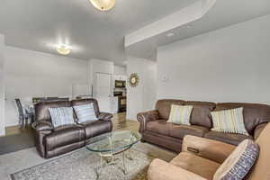 Living area with baseboards and wood finished floors
