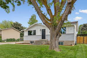 View of front of home featuring board and batten siding and brick siding