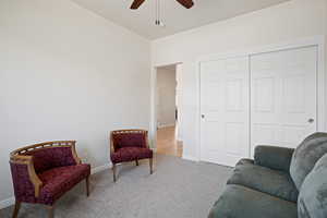 Bedroom with ceiling fan and carpet floors