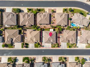 Aerial perspective of suburban area featuring a pool area