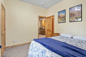Bedroom with carpet and baseboards