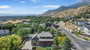 Aerial perspective of suburban area with a mountainous background