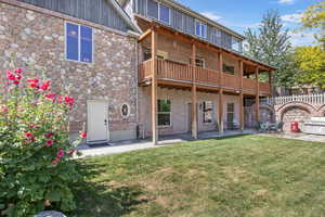 Back of property featuring a patio area, brick siding, and natural gas plumbed bbq.