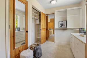 Primary closet and primary bathroom