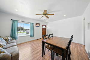 Dining room featuring plenty of natural light, ceiling fan, light wood-style flooring, and recessed lighting