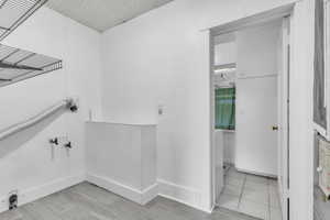 Laundry room going into the bathroom