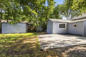 View of yard featuring a patio area and a storage shed
