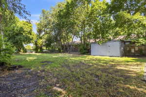 View of yard with a shed