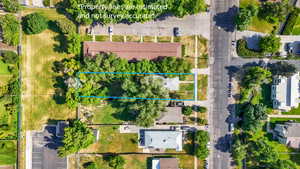 Aerial perspective of suburban area featuring property boundaries highlighted
