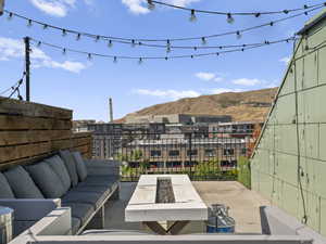 View of patio featuring an outdoor hangout area and a mountain view