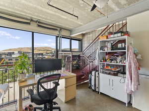 Office area featuring finished concrete flooring