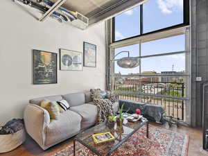 Living area with a high ceiling and finished concrete floors