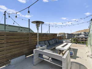 View of patio / terrace with an outdoor living space with a fire pit