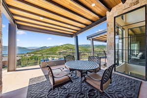 Balcony with a mountain view and outdoor dining area