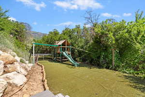 View of yard featuring a playground