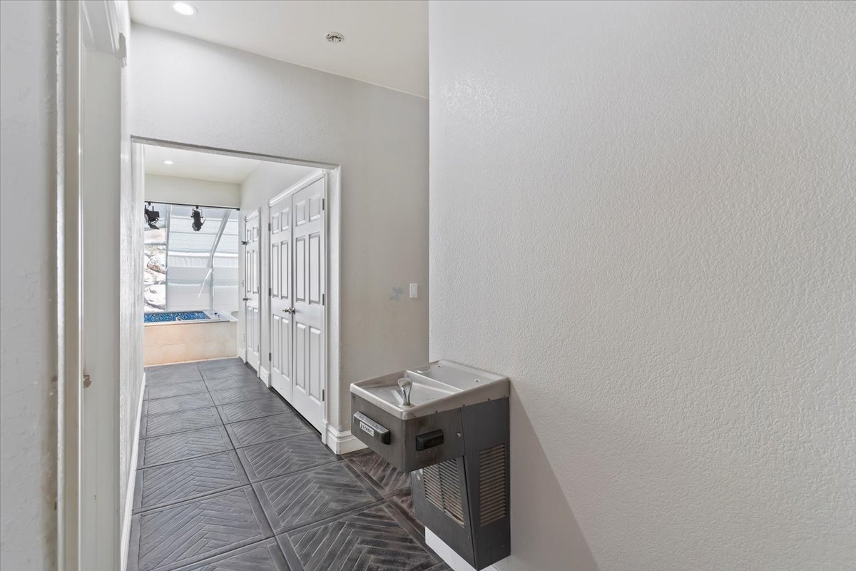 Hall with dark tile patterned floors