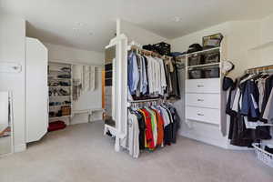 Walk in closet featuring carpet floors