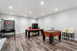 Rec room with recessed lighting, wood finished floors, and billiards
