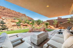 View of patio featuring an outdoor hangout area and a mountain view