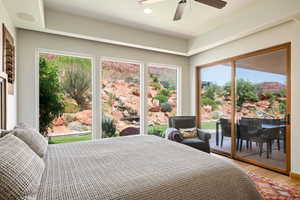 Bedroom with access to exterior, light wood finished floors, multiple windows, ceiling fan, and recessed lighting