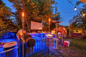 View of yard with an outdoor fire pit