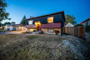 View of front of house featuring brick siding and concrete driveway