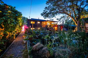 Back of house with a vegetable garden