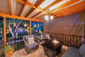 View of patio with an outdoor fire pit