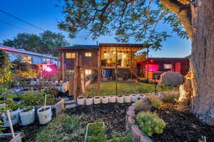 View of outbuilding with a vegetable garden