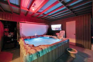 Outdoor covered space with hot tub & TV