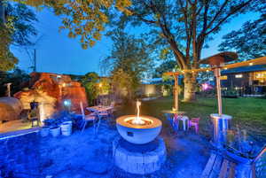 View of patio featuring a fire pit