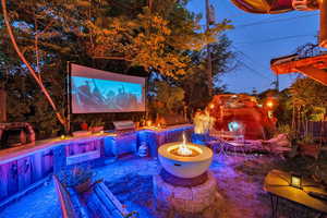 View of patio / terrace featuring a fire pit and area for grilling