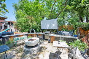 View of patio / terrace featuring area for grilling and a fire pit