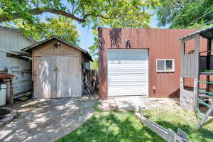 Garage featuring a storage shed