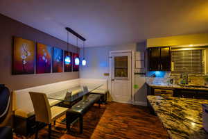 Dining room featuring tile and baseboards