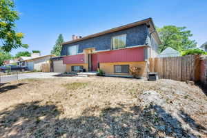 View of front of house featuring brick siding, driveway, and an attached garage